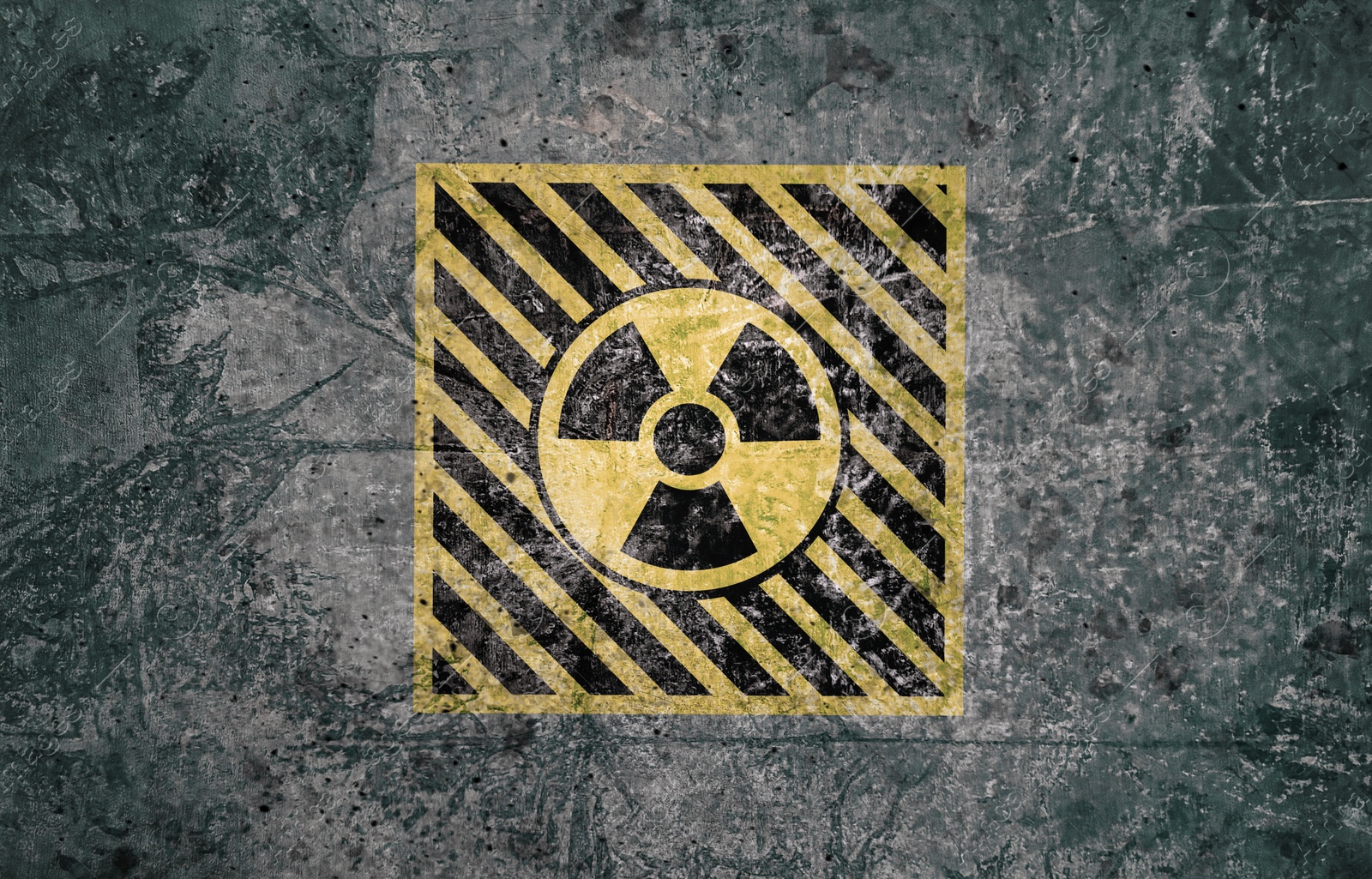 Image of Radioactive sign on grey textured surface. Radiological pollution