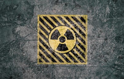 Image of Radioactive sign on grey textured surface. Radiological pollution
