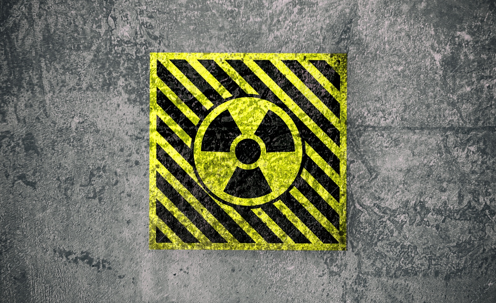 Image of Radioactive sign on grey textured surface. Radiological pollution