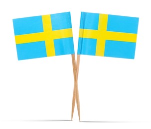 Image of Small paper flags of Sweden on white background