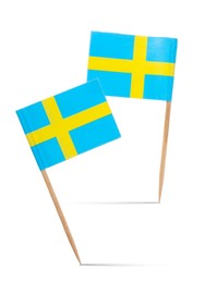 Image of Small paper flags of Sweden on white background