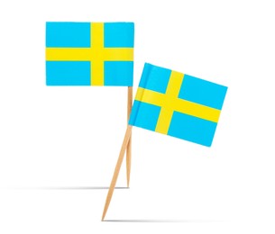 Image of Small paper flags of Sweden on white background