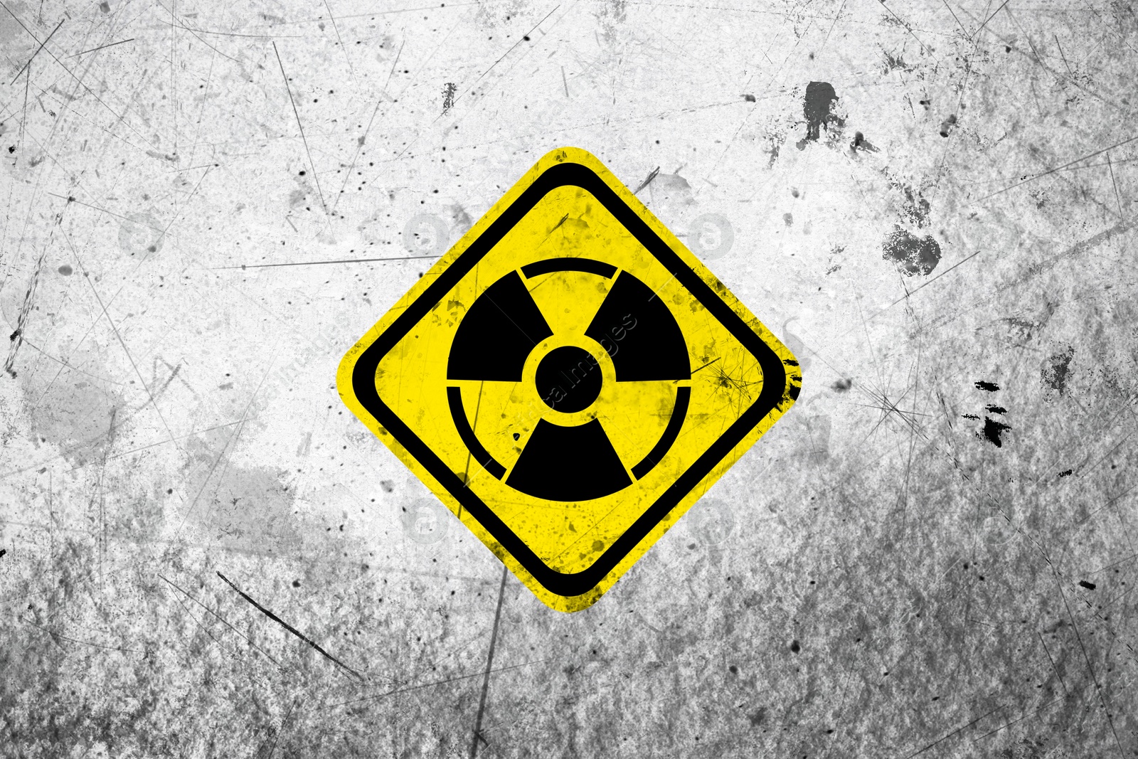 Radioactive sign on white textured surface. Radiological pollution Image of Radioactive sign on white textured surface. Radiological pollution