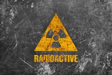 Image of Radioactive sign on grey textured surface. Radiological pollution
