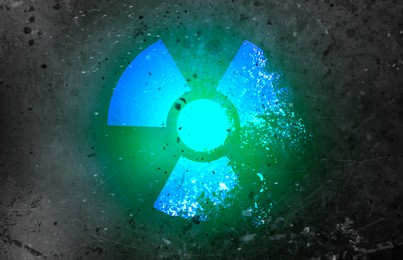 Image of Radioactive sign on dark grey textured surface. Radiological pollution