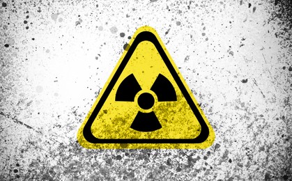Image of Radioactive sign on white textured surface. Radiological pollution