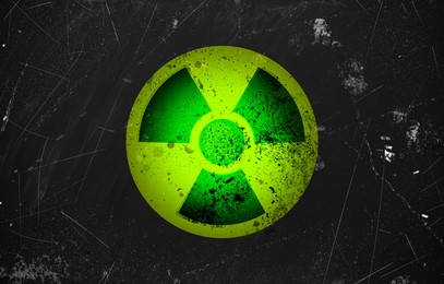 Image of Radioactive sign on black textured surface. Radiological pollution