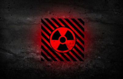 Image of Radioactive sign on black stone surface. Radiological pollution
