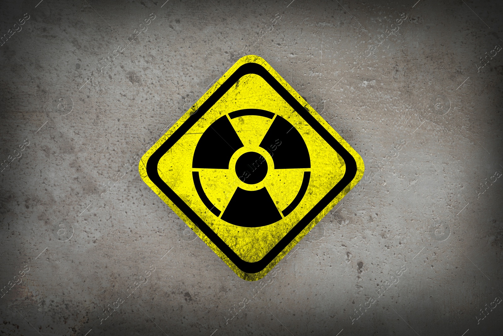 Radioactive sign on grey textured surface. Radiological pollution Image of Radioactive sign on grey textured surface. Radiological pollution