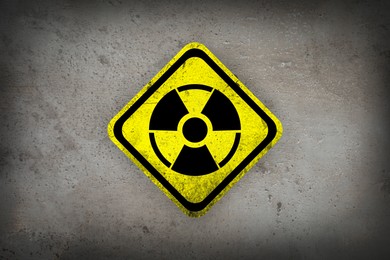 Image of Radioactive sign on grey textured surface. Radiological pollution