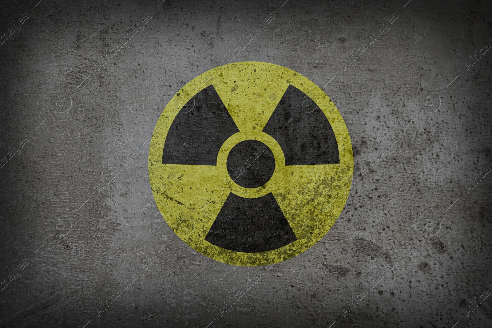 Image of Radioactive sign on grey textured surface. Radiological pollution
