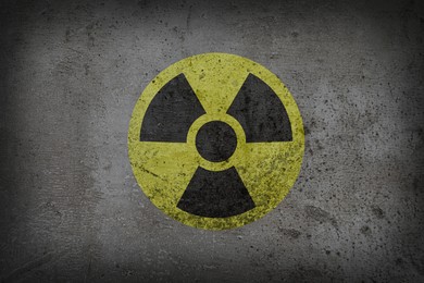 Image of Radioactive sign on grey textured surface. Radiological pollution