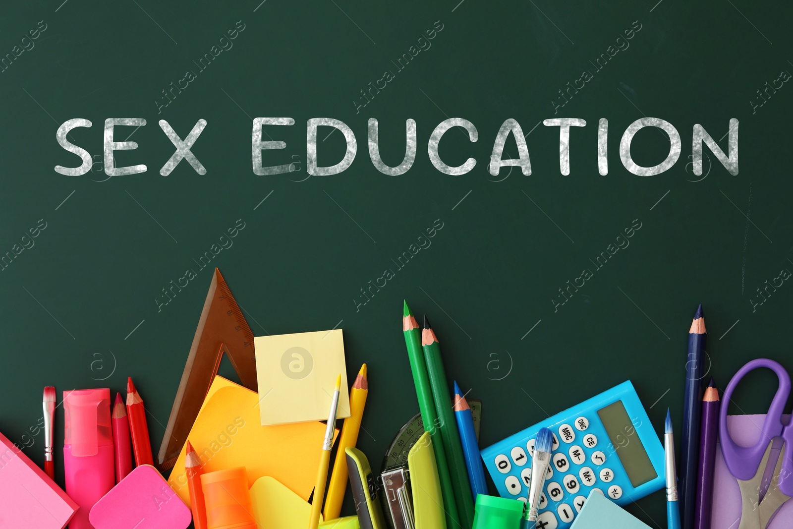 Sex Education inscription and stationery on green chalkboard, top view Image of Sex Education inscription and stationery on green chalkboard, top view