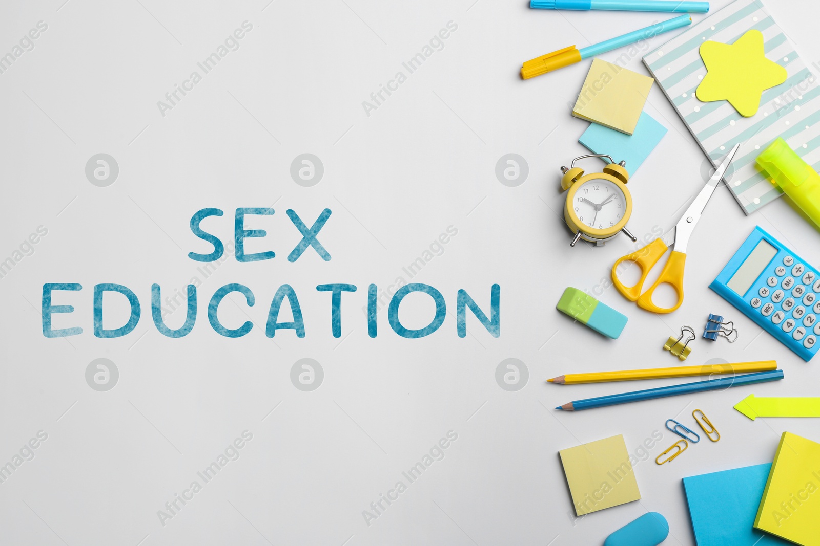 Sex Education inscription and stationery on white background, top view Image of Sex Education inscription and stationery on white background, top view