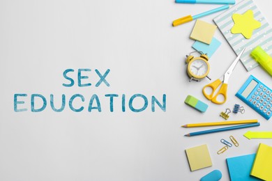 Image of Sex Education inscription and stationery on white background, top view