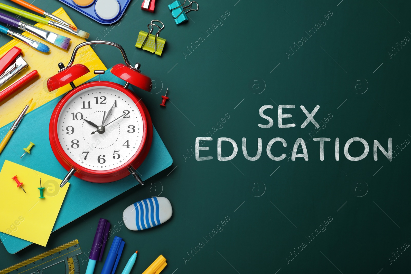 Sex Education inscription and stationery on green chalkboard, top view Image of Sex Education inscription and stationery on green chalkboard, top view