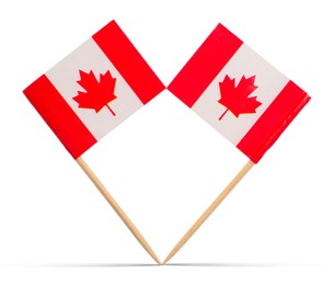 Image of Small paper flags of Canada on white background