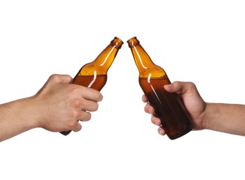 Image of Men clinking their bottles of beer together against white background