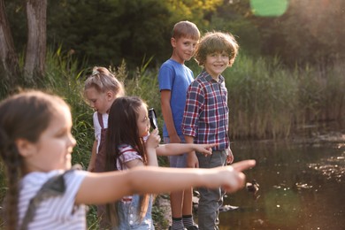 Photo of Children spending time in nature, selective focus