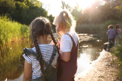 Photo of Children spending time in nature, selective focus