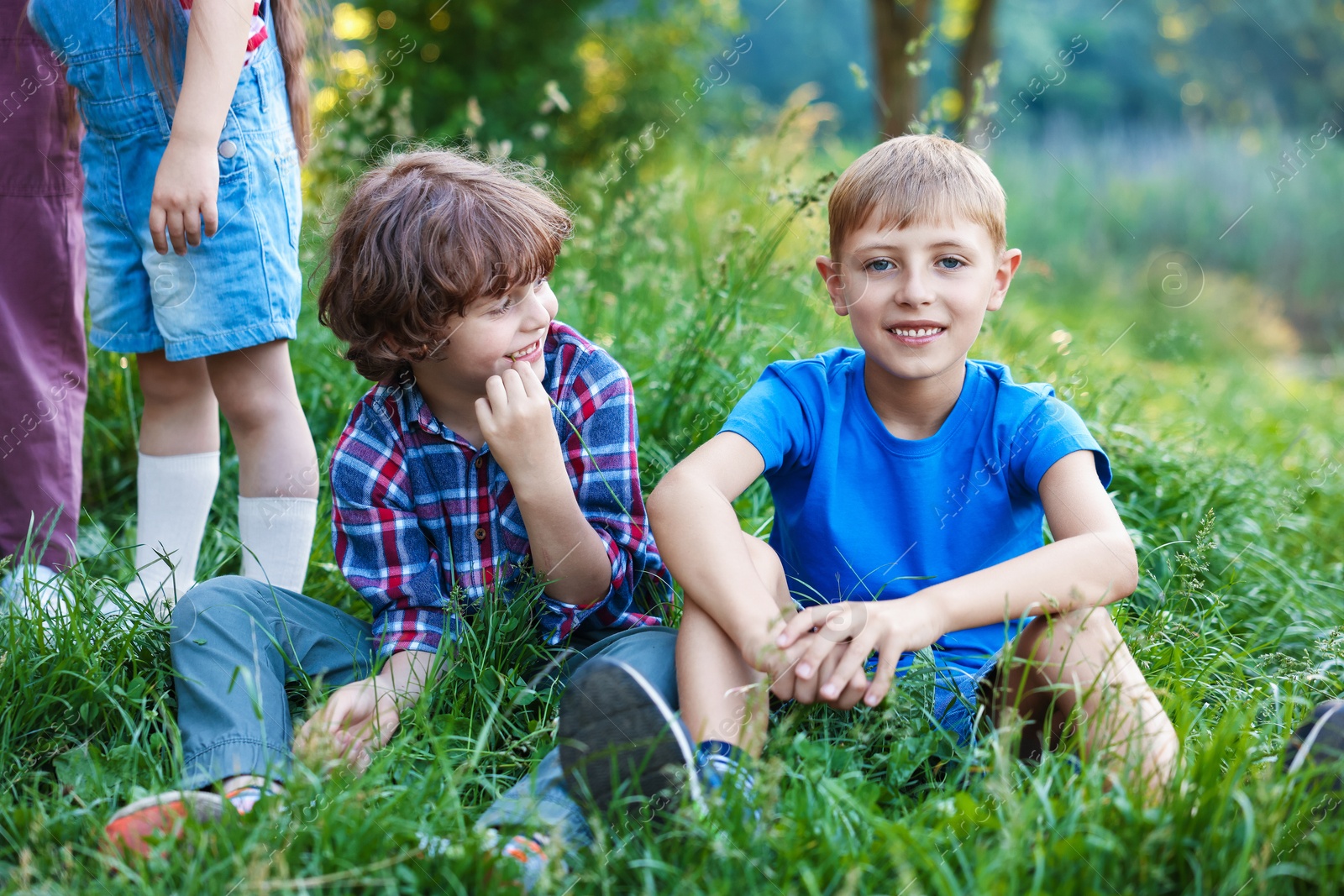 Children spending time in nature on summer day Photo of Children spending time in nature on summer day