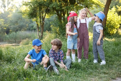 Photo of Group of children spending time in nature