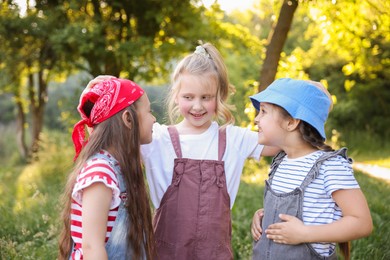 Photo of Portrait of cute little girls in nature