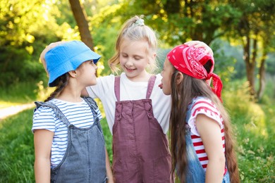 Photo of Portrait of cute little girls in nature