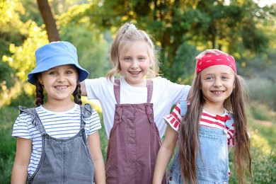 Photo of Portrait of cute little girls in nature