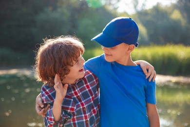 Photo of Portrait of cute little boys in nature