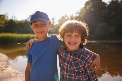 Photo of Portrait of cute little boys in nature