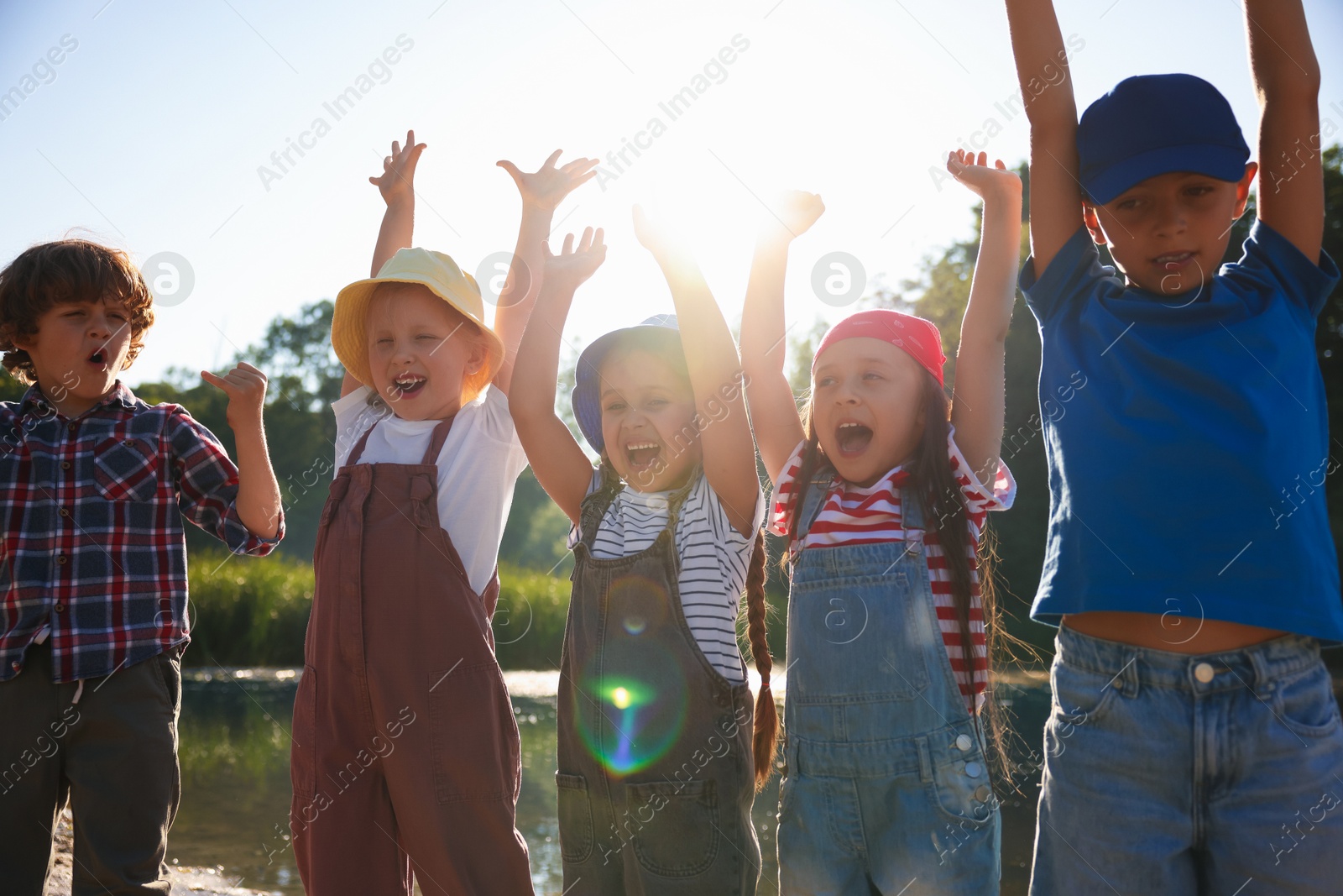 Happy children in nature on sunny day Photo of Happy children in nature on sunny day