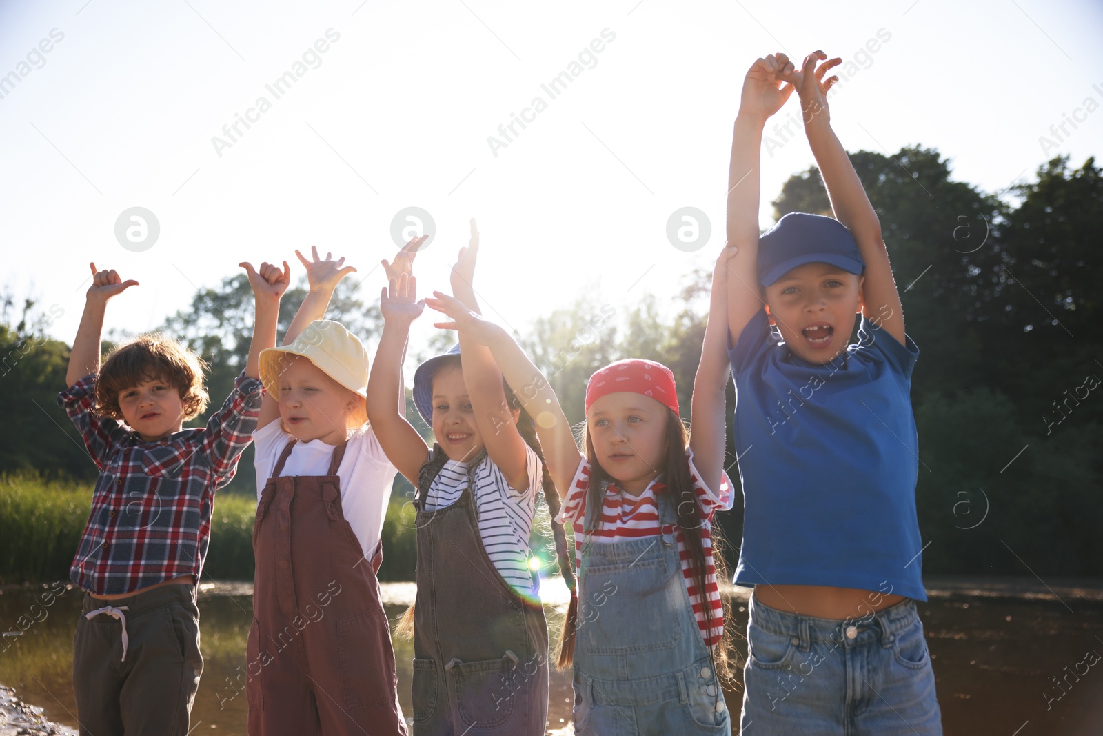 Happy children in nature on sunny day Photo of Happy children in nature on sunny day
