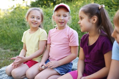 Photo of Children spending time in nature on summer day