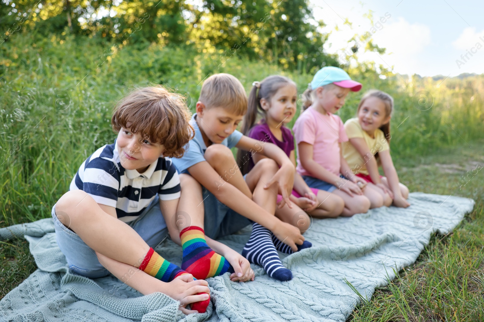 Children spending time in nature on summer day Photo of Children spending time in nature on summer day