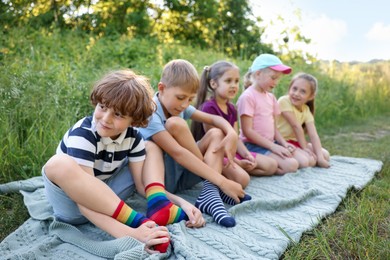 Photo of Children spending time in nature on summer day