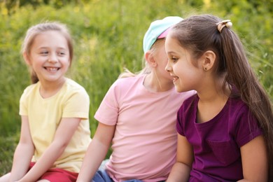 Photo of Children spending time in nature on summer day, selective focus