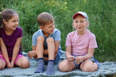 Photo of Children spending time in nature on summer day