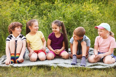 Photo of Children spending time in nature on summer day