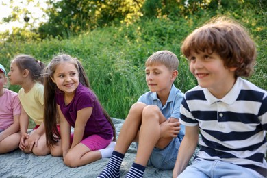Photo of Children spending time in nature on summer day