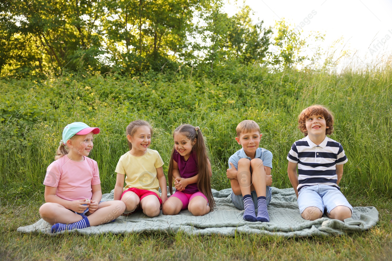Children spending time in nature on summer day Photo of Children spending time in nature on summer day