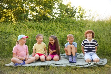 Photo of Children spending time in nature on summer day