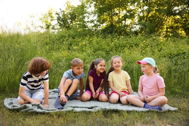 Photo of Children spending time in nature on summer day