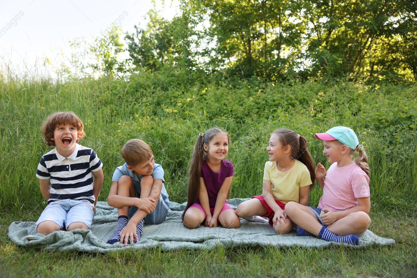 Photo of Children spending time in nature on summer day