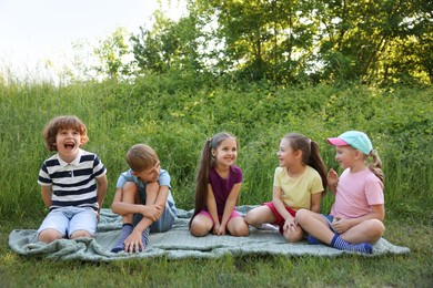 Photo of Children spending time in nature on summer day