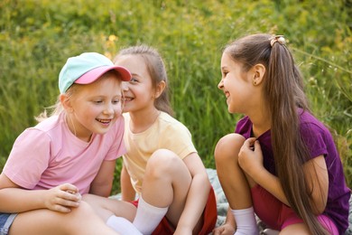 Photo of Children spending time in nature on summer day