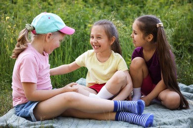 Photo of Children spending time in nature on summer day