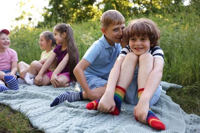 Photo of Children spending time in nature on summer day