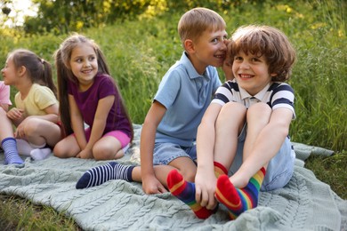 Photo of Children spending time in nature on summer day
