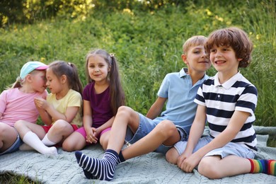 Photo of Children spending time in nature on summer day
